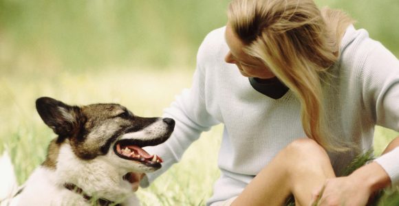 Woman sitting with dog